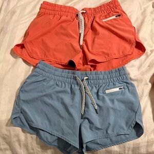 Vuori clementine Women's Athletic Shorts in coral and Blue